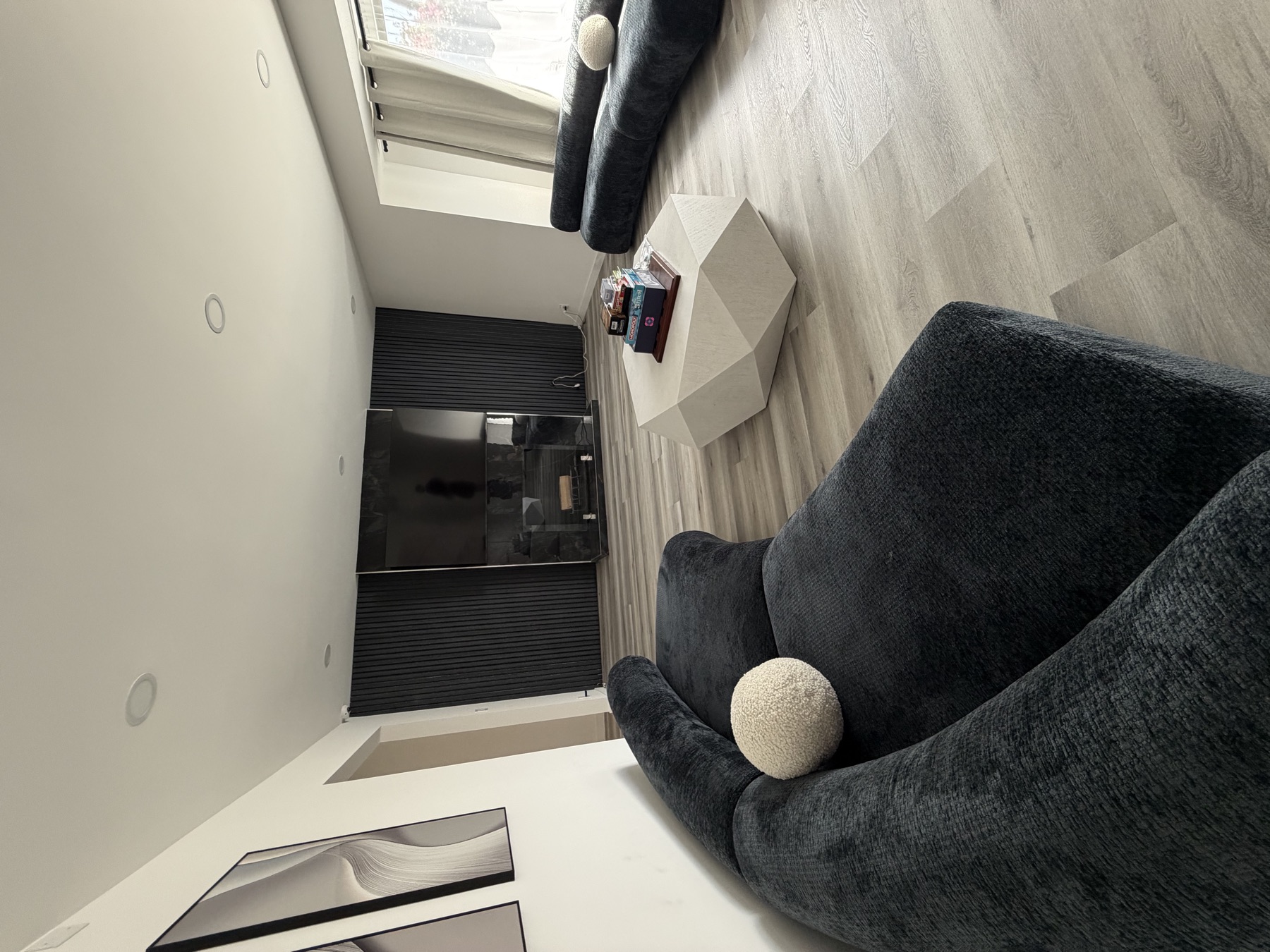 Bright living room with plush curved sofas